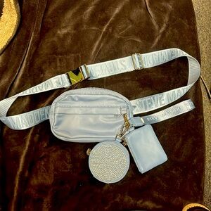 steve madden belt bag in baby blue with accessories